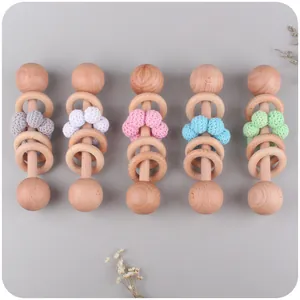 Handcrafted beech wood baby rattle set with colorful crochet beads for sensory play