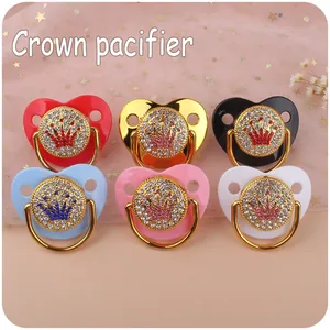 Set of 6 rhinestone crown baby pacifiers in various colors with golden pull rings