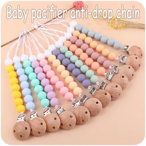 Piatto di catenelle per ciuccio in perle di silicone colorate con clip in faggio