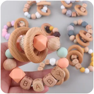 Handmade baby teether toy with beech wood rings and macaron silicone beads with BABY letters