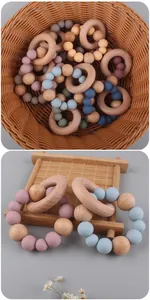 Macro detail of baby teether with beech wood rings and colorful silicone beads