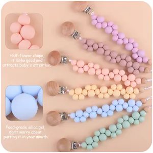 Chupeteros de silicona pastel con cuentas de flores y clips de madera para bebés