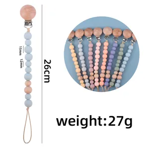 Chupetero de silicona y madera de haya con dimensiones 26cm longitud y 27g de peso