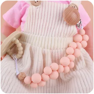 Chupetero de cuentas de silicona rosa con clip de madera para alivio de dentición de bebés