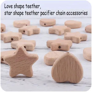 Macro shot of heart and star beech wood teething beads for DIY pacifier clips