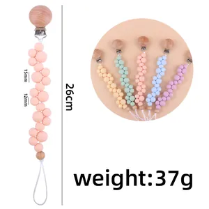 Sujetachupetes de silicona pastel con cuentas de madera y longitud total de 26cm
