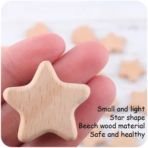 Macro shot of a smooth heart and star-shaped beech wood teething toy accessory