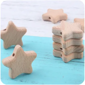 Macro view of star-shaped beech wood beads for DIY pacifier chains and teething toys