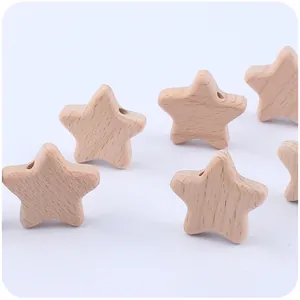 Close-up of natural beech wood star beads with pre-drilled holes for DIY pacifier clips