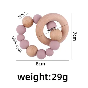 Beech wood ring with pink silicone beads baby teether toy showing dimensions and weight