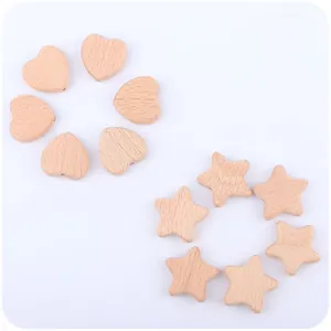 Macro shot of natural beech wood heart and star beads with smooth texture for DIY pacifier clips