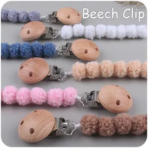 Handmade beech wood pacifier clip set with colorful crochet beads in six soft colors