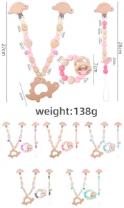 Detailed size specifications for dinosaur silicone teething bracelet and pacifier clip set