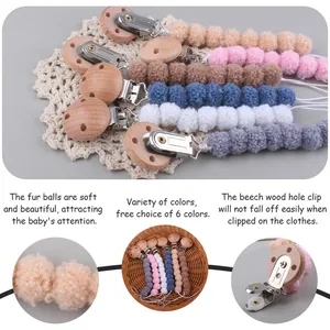 Beech wood pacifier clips with soft plush balls in six neutral colors for baby