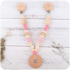 Baby Schnullerkette mit rosa Silikonperlen, Häkelperlen und Holz Beißring aus Naturmaterial