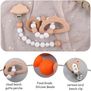Detail of beech wood cloud teether and silicone beads with cartoon bird clip