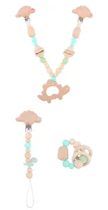 Three-piece baby teething set with wooden dinosaur clips and mint green crochet beads
