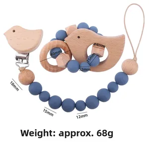 Detail of beech wood bird pacifier clip and silicone teething toy set with dimensions