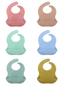Detail of adjustable neck straps and leak-proof pockets on 6 colorful silicone bibs