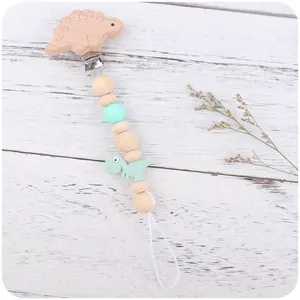 Dinosaur beech wood baby pacifier clip with green silicone beads for strollers