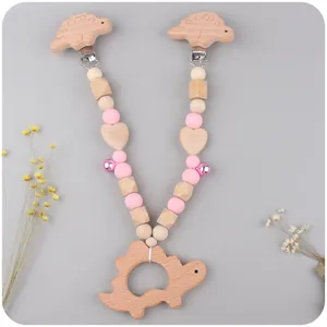 Silicone baby teething bracelet set with dinosaur wooden clips and purple metal bell