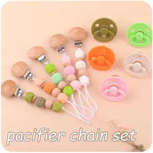 Detail view of handmade pacifier clips with beechwood clips and silicone beads