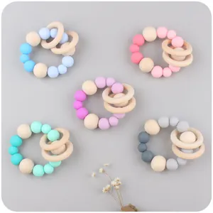 Baby silicone and wood teething rings with rattle beads in five assorted pastel colors