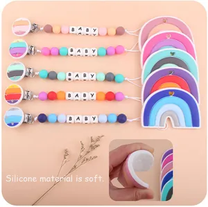 Close-up of soft silicone rainbow teether showing high flexibility and baby bead clip