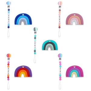 Detail of five colorful silicone rainbow teethers and matching baby pacifier clip chains