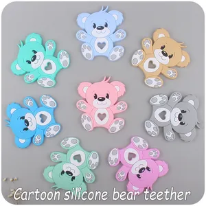 Macro shot of colorful bear-shaped silicone baby teethers with heart-shaped cutouts