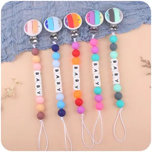 Five colorful silicone baby pacifier clips with rainbow beads and BABY letter charms