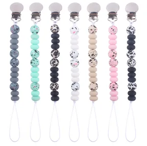 Detailed set of baby pacifier clips featuring leopard print and colorful silicone beads