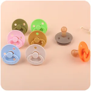 Set of 8 colorful silicone baby pacifiers with beech wood clips and breathable shields