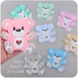 Detailed close-up of cute bear-shaped silicone teethers in various pastel colors