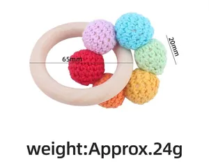 Detailed view of baby beech wood ring with colorful crochet beads for teething relief