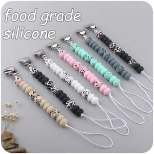 Set of 7 food-grade silicone pacifier clips with leopard prints and metal fasteners