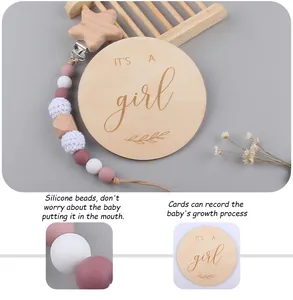 Detail of wooden milestone card and pacifier clip set with beads and crochet star