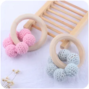 Natural wooden baby teether ring with pink and blue handmade crochet beads toy