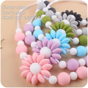 Macro shot of colorful silicone flower beads for handmade baby teething necklaces