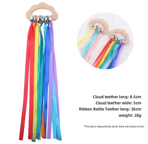Cloud-shaped beechwood baby rattle with colorful ribbons and silver bells details