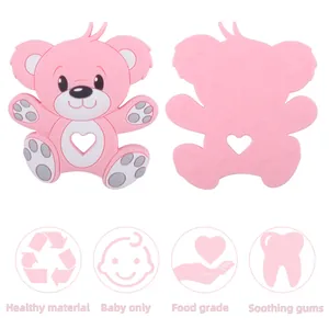Pink cartoon bear silicone baby teether with heart cutout and textured surface