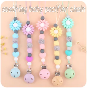 Close-up of five silicone pacifier chains in macaron colors with sunflower and heart beads