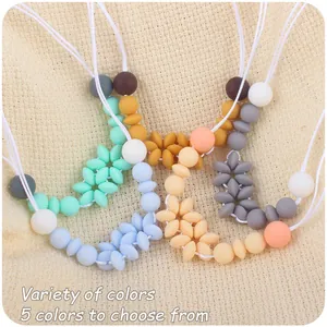 Collana da dentizione a fiori in silicone in cinque colori pastello per il bambino