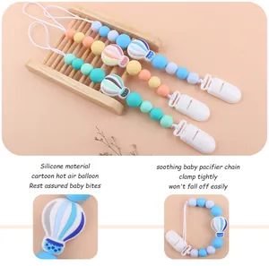 Three silicone pacifier clips with cartoon hot air balloon beads in macaron colors