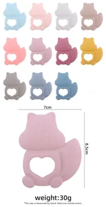 Detailed view of squirrel silicone teether with textured surfaces and heart-shaped grip