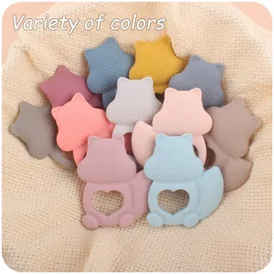 Detail of silicone squirrel teether showing textured massage surface and heart grip