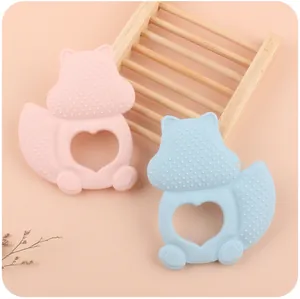 Detail of pink and blue squirrel baby teethers with textured surfaces for gum massage