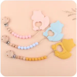 Three silicone squirrel teethers with beaded pacifier clips in pastel colors