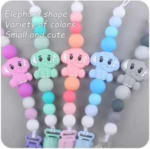 Detail view of silicone elephant pacifier clips in five pastel macramé color variations