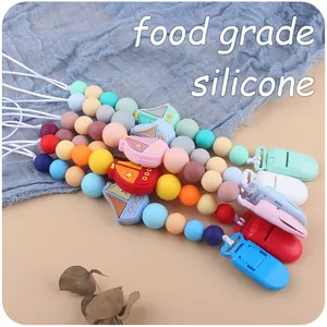 Detail of food grade silicone pacifier clips with colorful beads and sailboat charms